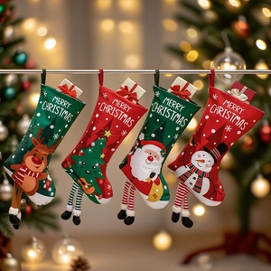 Set of 4 Christmas stockings with elk, snowman, Santa, and tree designs on a festive background