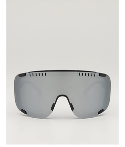 Close-up of professional ski goggles featuring a silver mirrored lens and black frame details