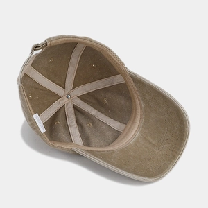 Inside view of khaki washed cotton baseball cap with reinforced seams and cotton label