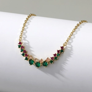 Detailed view of gold chain necklace with multicolor round zircon smile pendant crystals