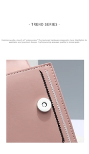 Detail of pink leather handbag with magnetic snap closure and fine cross-stitch detailing