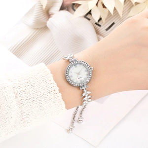 Elegant silver quartz watch for women with rhinestone leaf-shaped bracelet strap