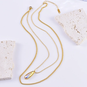 Double-layer gold necklace with colorful teardrop crystal pendant and beaded chain links