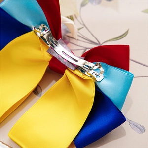 Detail of multi-color ribbon bow hair clip with a secure metal alligator fastener
