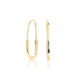 Detailed view of gold-plated safety pin earrings with a high-polished minimalist finish