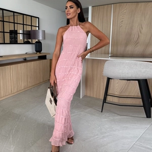 Detail view of the layered pleated texture on this elegant pink halter neck long dress