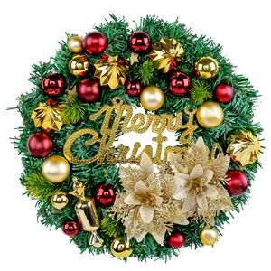Artificial Christmas wreath with red and gold baubles and Merry Christmas sign