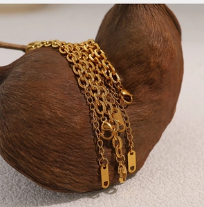 Macro shot of 18K gold plated stainless steel textured chain with lobster clasp detail