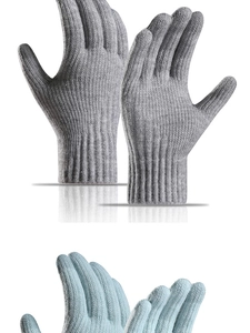 Close-up of thick knitted winter gloves featuring long ribbed cuffs in gray and light blue