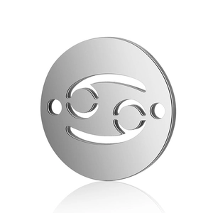 Macro view of a round silver stainless steel Cancer zodiac connector for DIY jewelry