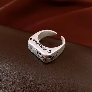 Vintage silver open ring featuring engraved stars and rabbit motif in matte finish