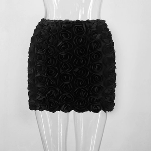 Detail of black mini skirt with 3D rose texture design on transparent mannequin