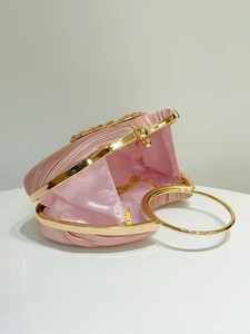 Pink heart-shaped pleated satin evening bag featuring gold metal frame and chain
