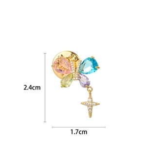 Close-up of butterfly brooch with colorful crystal stones and a sparkling star charm