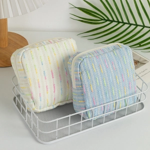 Large capacity striped woven cosmetic bags for makeup and toiletries in cream and blue