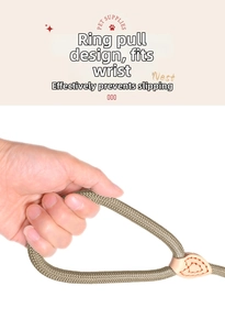 Detail of army green woven leash handle with circular grip and leather heart reinforcement