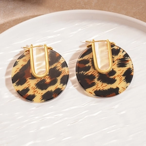 Detailed view of leopard print acrylic round earrings with 18k gold-plated U-shaped buckle