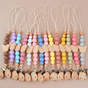 Silicone and wood pacifier clips set with bear motifs in multiple pastel colors