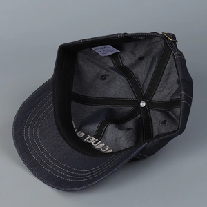 Detailed macro view of 100% cotton denim fabric texture and inner metal strap buckle