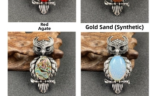 Detail view of owl pendants set with Red Agate, Goldstone, Abalone and Opal gemstones