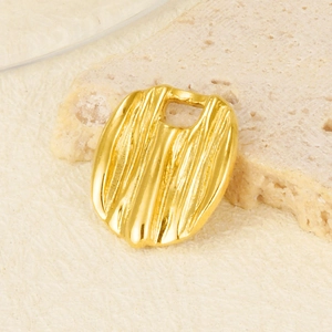 Macro detail of golden oval pendant showing irregular vertical stripe texture and finish