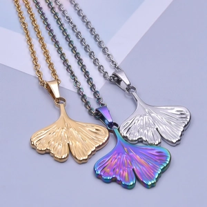Ginkgo leaf pendant necklaces in gold, silver, and rainbow finishes on cable chains