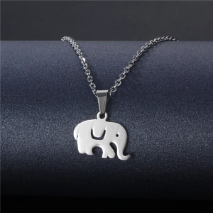 Polished silver elephant pendant necklace in stainless steel on a display stand