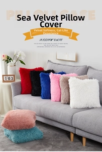 Close-up of soft plush pillow covers in vibrant colors arranged on a sofa