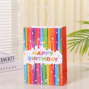 Colorful vertical striped paper gift bag with Happy Birthday text and rope handles