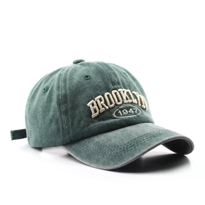 Washed dark green cotton baseball cap featuring vintage Brooklyn 1947 embroidery detail