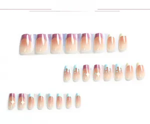 Close-up of blue and purple French press-on nails with white star and drip heart designs