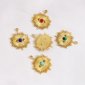Five gold stainless steel starburst eye pendants with colorful gemstone inlays