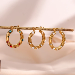 18K gold plated hoop earrings with colorful zircon and pearls on display stand
