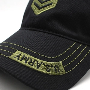 Detailed close-up of U.S. ARMY embroidery on a black cotton tactical camouflage baseball cap