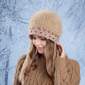Chic knit beanie for women with brown faux fur pom pom and colorful speckled yarn texture