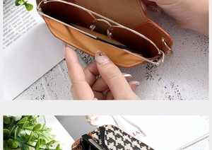 Detail of portable glasses pouch with houndstooth and leather texture and chain