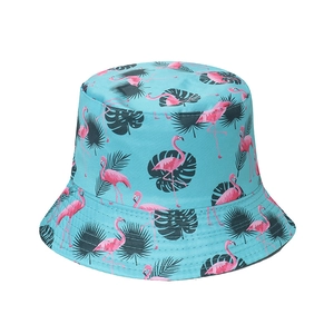 Women's sun hat featuring pink flamingo and green palm leaf patterns on light blue canvas