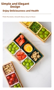 Close-up of colorful ceramic snack bowls on a bamboo tray with fruits and nuts