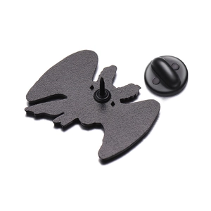 Detail view of the black bat brooch back with needle and rubber pin clutch closure
