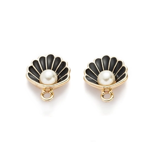 Detailed view of shell-shaped alloy pendants with black enamel and pearl accents