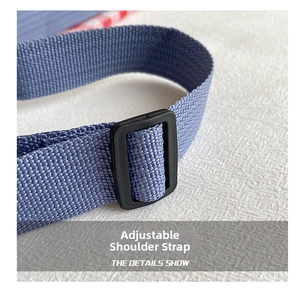 Detail of blue nylon woven adjustable shoulder strap with black plastic buckle closure