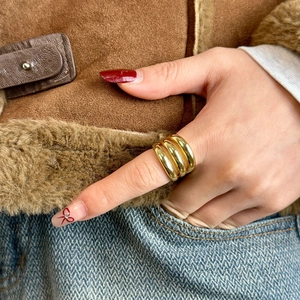 Detailed close-up showing the texture of an 18k gold plated multi-layer open ring
