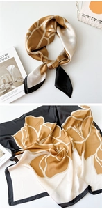 Detail of silk-satin floral square scarf in champagne gold and black with art book setup