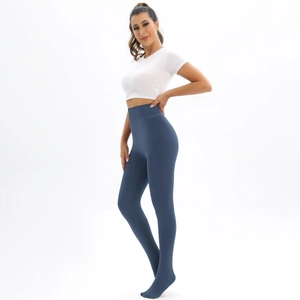Detail of high-waisted fleece lined leggings in foggy blue with footed design