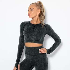 Detail of acid wash seamless knit long sleeve crop top and high waist sports leggings
