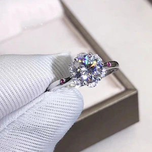 Detailed view of one carat floral halo ring featuring a sparkling high-carbon diamond