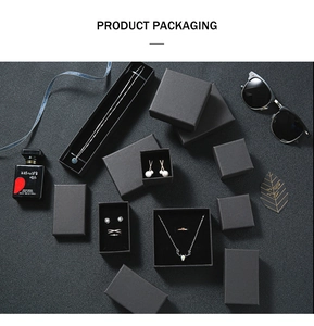 Flat lay of luxury black jewelry gift boxes for necklaces and rings with textured finish