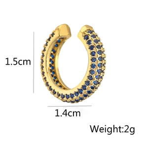 Detailed view of U-shaped gold ear cuff with blue zircons, size 1.5x1.4cm and weight 2g
