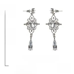 Detailed view of Baroque drop earrings with heart-shaped zircon stones and 925 silver pins