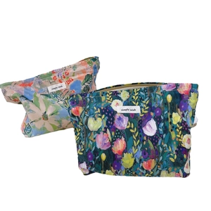Floral cotton makeup bags in cream and navy blue with elegant flower prints